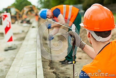 Builders working along Stock Photo