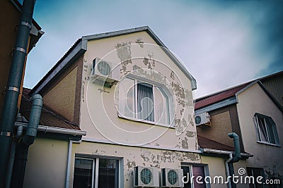 The building is air conditioned and has windows. Spoiled old paint on the walls Stock Photo