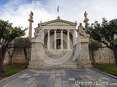 The building of the Athens Academy a marble column with a sculptures of Apollo and Athena, Socrates and Plato against a with cloud Stock Photo