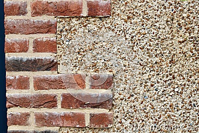 Building background with combination of bricks and pebble dashing with copyspace Stock Photo