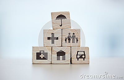 Building blocks, pyramid and life insurance for medical, car loan or home on background mockup, table or desk mock up Stock Photo