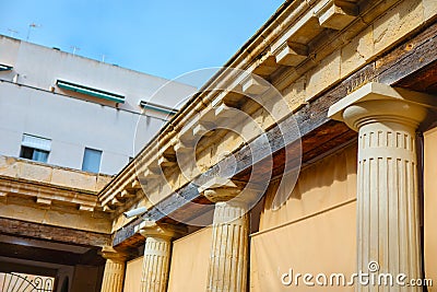 Building with classical architectural elements and fluted columns Stock Photo