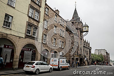 The building of the classical Tolbooth Tavern with a large clock above the Canongate street Editorial Stock Photo