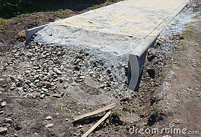 Building construction house garden footpath with pavers. Pavement laying construction Stock Photo