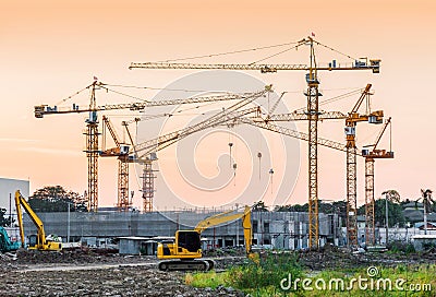 Building construction site with tower crane machinery Stock Photo