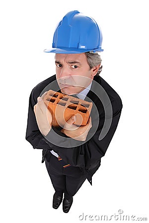 Building contractor with brick Stock Photo