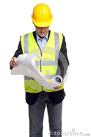 Building contractor in safety gear with plans Stock Photo