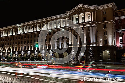 Building of Council of Ministers in Sofia, Bulgaria. Night view with traffic light trails. Stock Photo