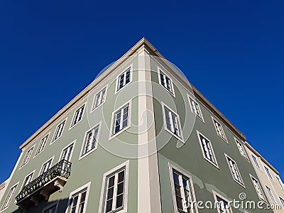 Building facade corner against blue sky Stock Photo
