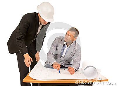 Building foreman and architect discussing a plan Stock Photo