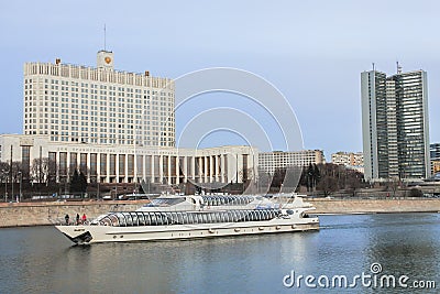 Building of the government of the Russian Federation, Building of Moscow governmet and pleasure boat on the Moscow river. Editorial Stock Photo
