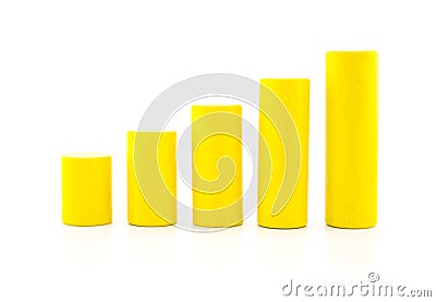 building a growing financial graph using yellow color wood toy. Stock Photo