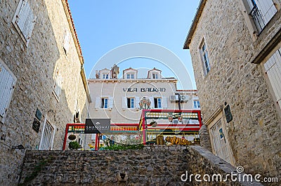 Building of historical archive, Chinese restaurant Shanghai, Apartments Vila Balkan in Old Town, Budva, Montenegro Editorial Stock Photo