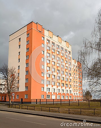 Dormitory of doctors and medical workers in Gomel. The multi-storey building is orange-yellow Stock Photo
