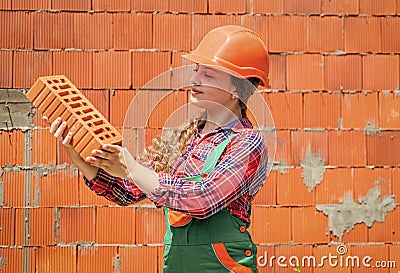building a house. Kid build construction. engineer teen worker. Professional craftsman or workman. International workers Stock Photo