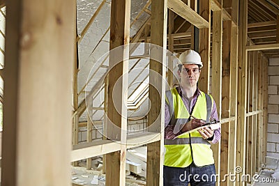 Building Inspector Looking At New Property Stock Photo