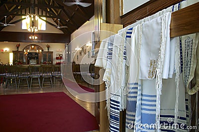 Building interior of a synagogue with a close-up of the tallit worn as a prayer shawl by religious Jews Editorial Stock Photo