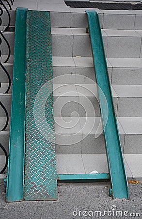 Building metal ramp for wheelchair entry and steps. Stock Photo