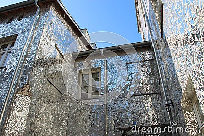 Building with mirrored walls. Facade of building made of mirror fragments Editorial Stock Photo