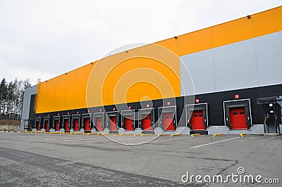 The building of a modern logistics center. Front view of loading docks Stock Photo