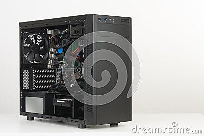 Building of PC, ATX motherboard inserted to black computer midi Stock Photo