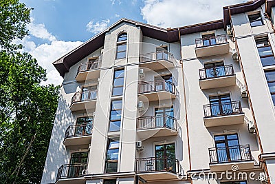 Building of a residential multi-storey building with a balcony close-up. Editorial Stock Photo