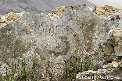 Building of ruins with text Dionis Stock Photo