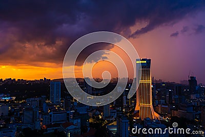 Building skyscraper maybank at sunset rain clouds. Gorgeous views of the landscapes of Kuala Lumpur Editorial Stock Photo