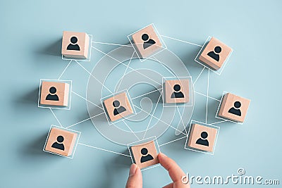 Building a strong team, Wooden blocks with people icon on background, Human resources and management concept. Stock Photo