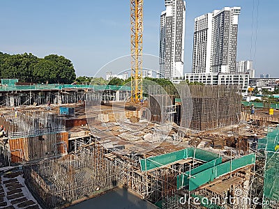 Building substructure and super-structure under construction using the open-cut method. Editorial Stock Photo