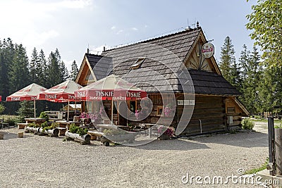 Building with tables and umbrellas in Zakopane Editorial Stock Photo