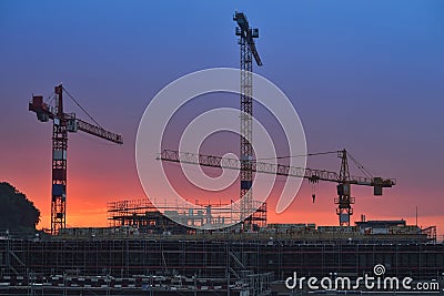 Building under construction at sunset. Night scenes Stock Photo