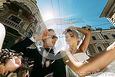 Buildings and amazing couple in the car Stock Photo