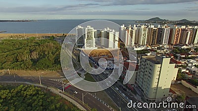 Buildings and houses in front of the beach. Camburi beach, Vitoria city, Espitiro Santos state of Brazil stock footage Buildings and houses in front of the beach. Camburi beach, Vitoria city, Espitiro Santos state of Brazil stock footage