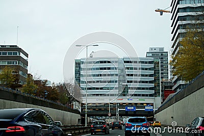 Buildings over the highway named Utrechtsebaan in The Hague on highway A12. Editorial Stock Photo