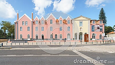 Buildings with Pink Wall and Triangular Roof Editorial Stock Photo