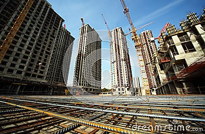 Between buildings under construction and cranes Stock Photo