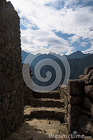 Buildings, walls and terraces of the mystic Inca city Machu Picchu in the Andes Stock Photo