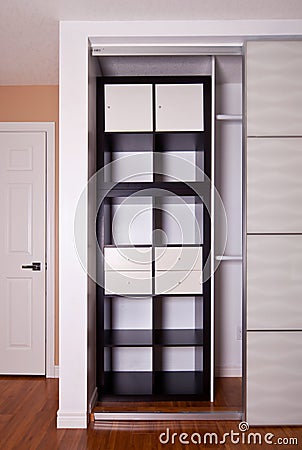 Built-in closet with sliding door shelving storage organization Stock Photo
