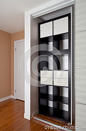 Built-in closet with sliding door shelving storage organization Stock Photo