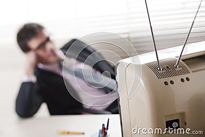 Buinessman watching a stylish retro TV Stock Photo