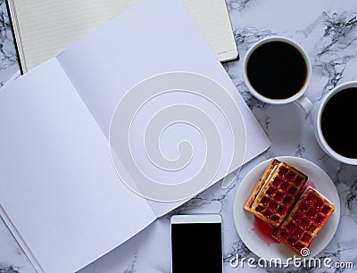 Buisness lunch with coffe anf waffles and planning the day and smartphone Stock Photo