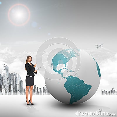 Buisnesswoman with big earth globe Stock Photo