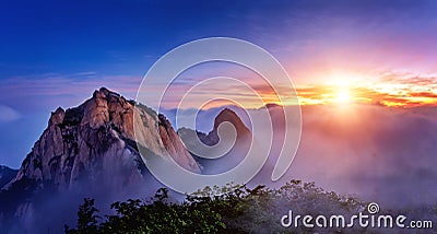 Bukhansan mountains is covered by morning fog and sunrise. Stock Photo