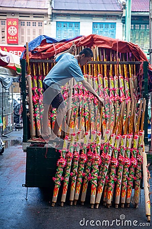 A man arrange the dragon joss tick to transfer to temple. Editorial Stock Photo