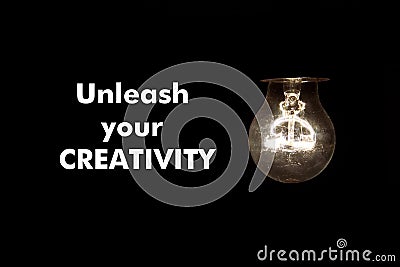 Bulb with text UNLEASH YOUR CREATIVITY Stock Photo