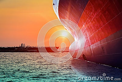 Bulbous bow ship sailing in the sea with sunset Stock Photo