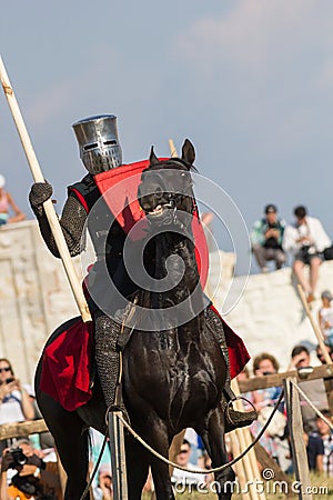 Bulgar, Russian Federation - August 2018, - man in battle armor riding a horse at the international festival of the Editorial Stock Photo