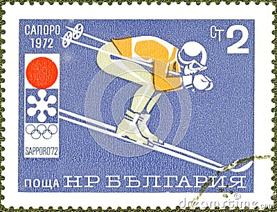 Postage stamp printed in Bulgaria with the image of mountain skier, with the inscription in Bulgarian `Sapporo, 1972` Editorial Stock Photo