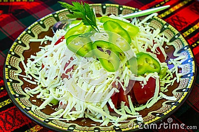 Bulgarian Shopsky Salad made of tomatoes, cucumbers and cheese Stock Photo